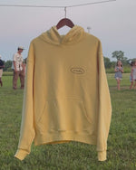 Load and play video in Gallery viewer, OVAL LOGO HOODIE BUTTER YELLOW
